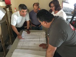 Photo of Ravena Huboi meeting with construction team